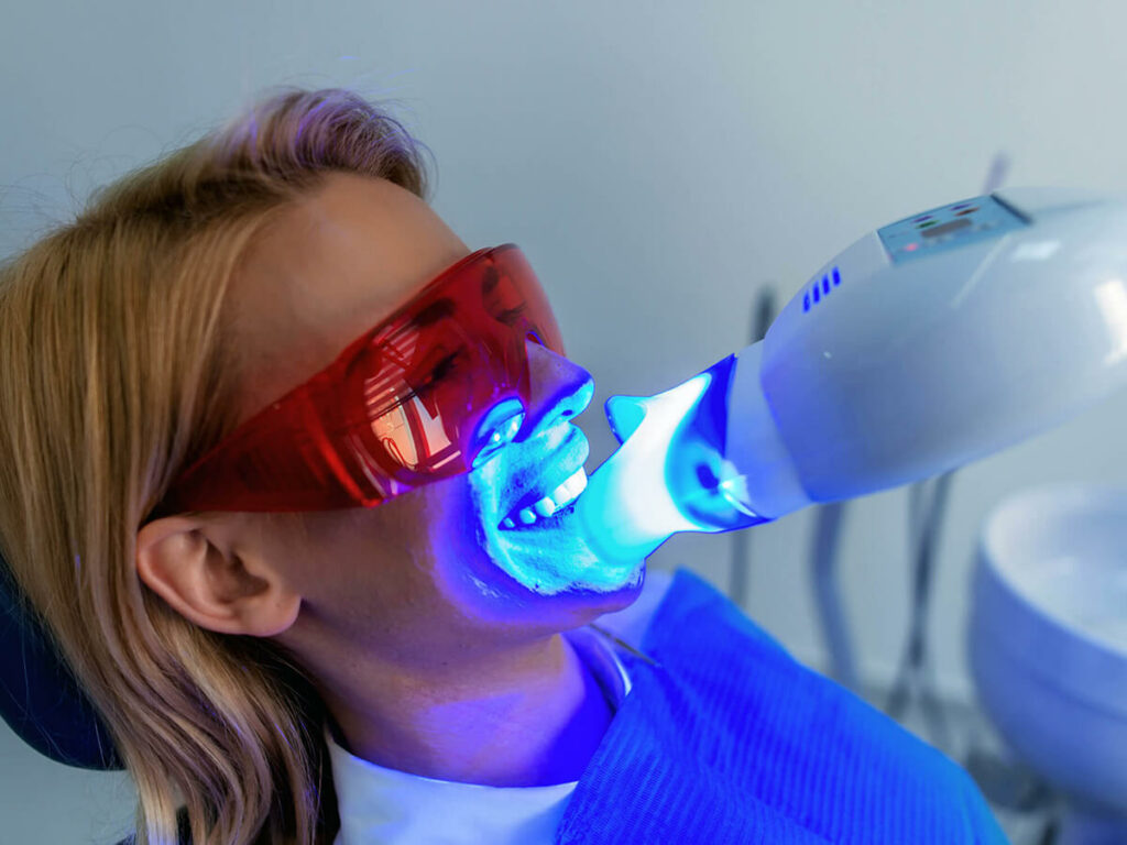 patient receiving teeth whitening treatment