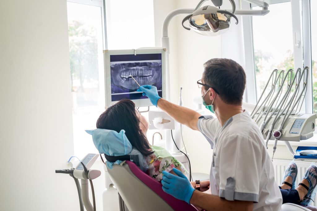 dentist pointed to xray to show patient