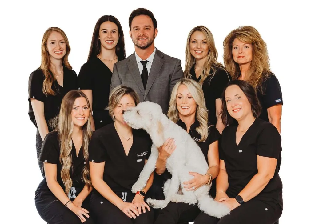 Byrne Dental team photo with dog